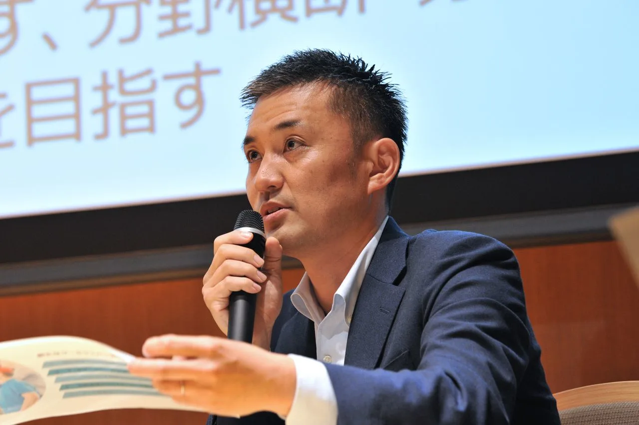 2024年に決定した新たなクールジャパン戦略を説明する田中氏。撮影／柏原力